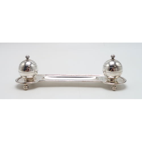 2459 - AN ART DECO SILVER INKSTANDby Adie Brothers, Birmingham 1937, of oblong form, with two stylised inkw... 