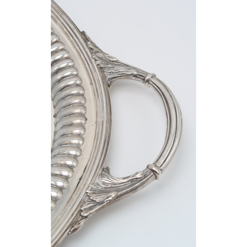 2462 - A VICTORIAN SILVER TWIN-HANDLED SERVING TRAYby Barnard Brothers, London 1895, of oval form, with aca... 