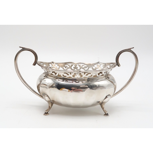 2463 - A GEORGE V SILVER PART TEA SERVICEby William Adam, Birmingham 1930, of faceted oval form, with appli... 