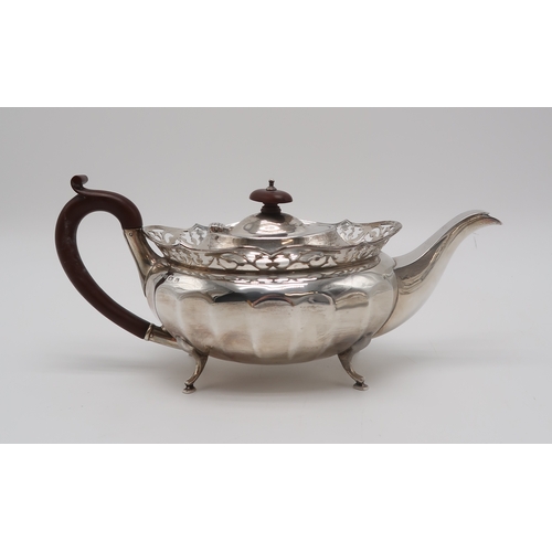 2463 - A GEORGE V SILVER PART TEA SERVICEby William Adam, Birmingham 1930, of faceted oval form, with appli... 