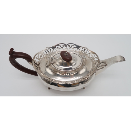 2463 - A GEORGE V SILVER PART TEA SERVICEby William Adam, Birmingham 1930, of faceted oval form, with appli... 