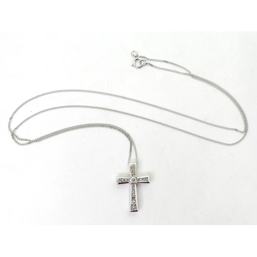 781 - A 9ct white gold cross and chain set with estimated approx 0.25cts of brilliant cut diamonds, weight... 