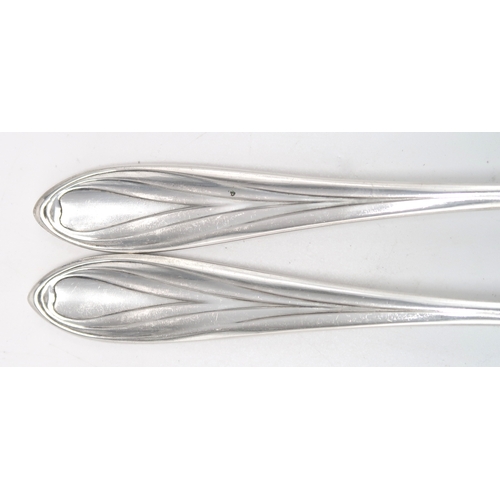 2464 - A SET OF SIX GERMAN ART NOUVEAU SILVER FORKS800 standard, the pointed stems of stylised form, with a... 