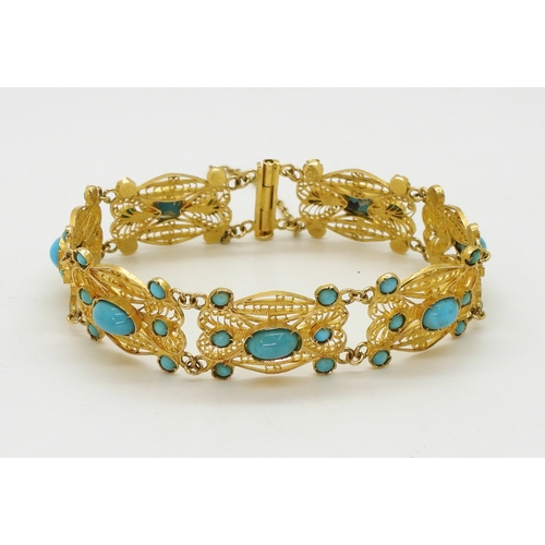 2701 - A FILIGREE AND TURQUOISE BRACELETmade in bright yellow metal stamped with Arabic marks verso and 750... 