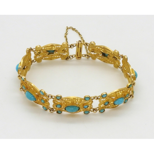 2701 - A FILIGREE AND TURQUOISE BRACELETmade in bright yellow metal stamped with Arabic marks verso and 750... 