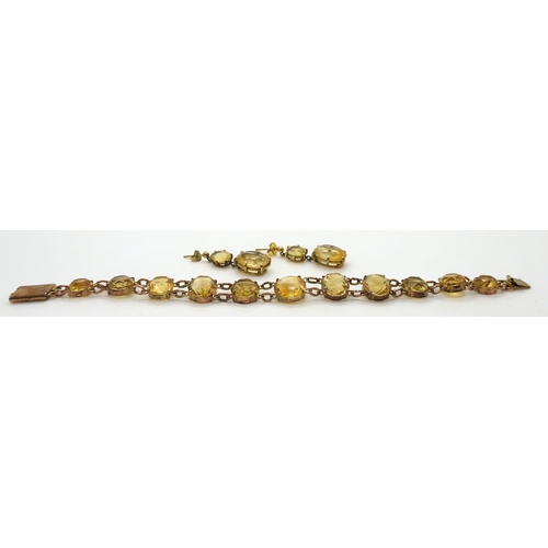 2703 - A CITRINE BRACELETset with round facet cut citrines that taper gently from 12.3mm to 8.4mm, with 9ct... 