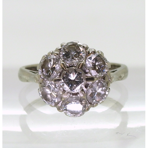 2704 - A DIAMOND FLOWER RINGthe classic mount in 18ct white gold is set with estimated approx 1.75cts of br... 