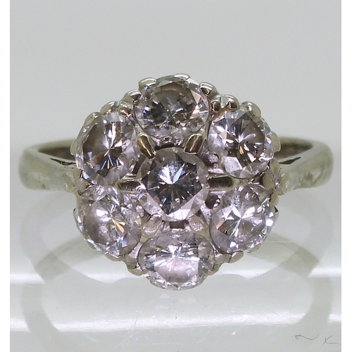 2704 - A DIAMOND FLOWER RINGthe classic mount in 18ct white gold is set with estimated approx 1.75cts of br... 