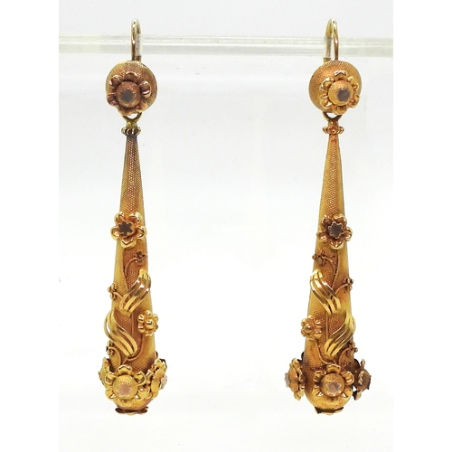 2706 - VINTAGE CONTINENTAL EARRINGSthe long drop yellow metal earrings have applied flower motifs, with con... 