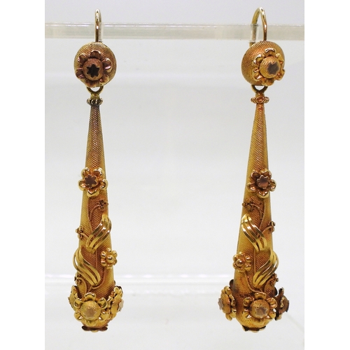 2706 - VINTAGE CONTINENTAL EARRINGSthe long drop yellow metal earrings have applied flower motifs, with con... 