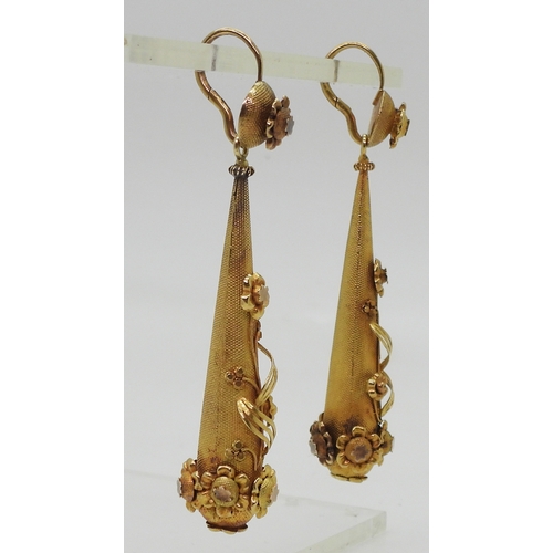 2706 - VINTAGE CONTINENTAL EARRINGSthe long drop yellow metal earrings have applied flower motifs, with con... 