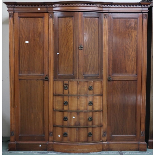 101 - An Edwardian mahogany compactum wardrobe with dentil cornice over pair of bow fronted doors over fou... 