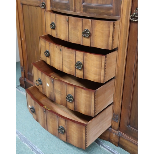 101 - An Edwardian mahogany compactum wardrobe with dentil cornice over pair of bow fronted doors over fou... 