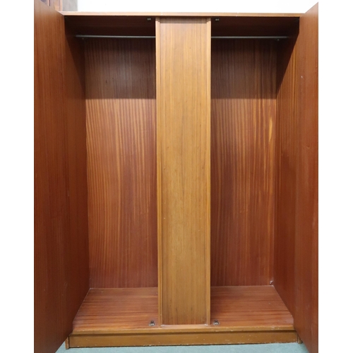 107 - A mid 20th century teak two door wardrobe, 169cm high x 122cm wide x 57cm deep