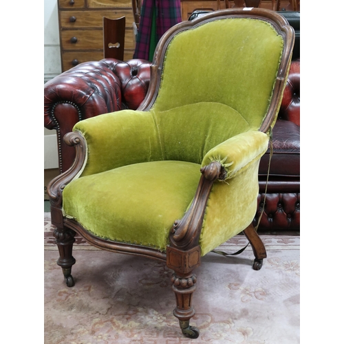 19 - A Victorian walnut framed parlour armchair with green velour upholstery on turned supports, 97cm hig... 