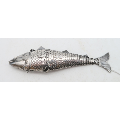 365 - A white metal articulated fish pill box, 15cm