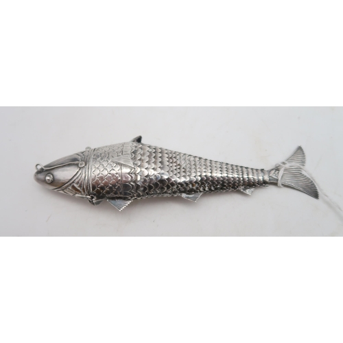 365 - A white metal articulated fish pill box, 15cm