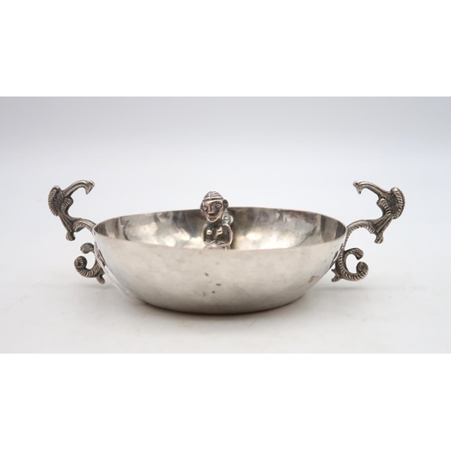 382 - A Peruvian silver bowl, of circular form, decorated with a central figure standing and two others to... 