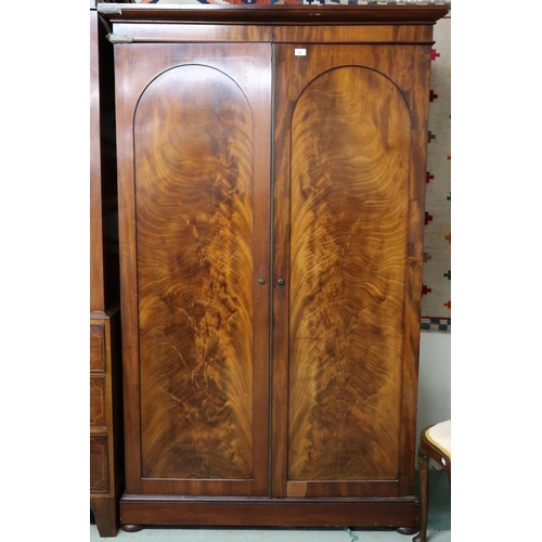 81 - A Victorian mahogany and walnut veneered two door wardrobe, 196cm high x 120cm wide x 55cm deep