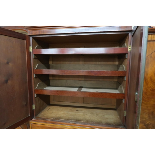 82 - A Victorian mahogany linen press with moulded cornice over pair of doors enclosing linen drawers on ... 