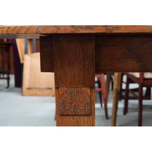 89 - An early to mid 20th century oak E Gomme D end table on rectangular supports with carved decoration ... 