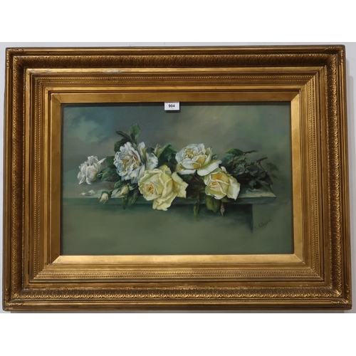 904 - ISA J LAMONT Roses on a shelf, signed, oil on board, 40 x 60cm