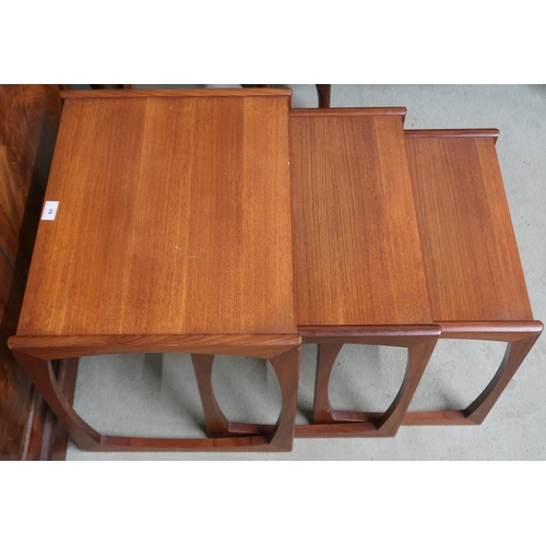 91 - A mid 20th century teak G Plan nest of three tables with stylized supports, 49cm high x 53cm wide x ... 