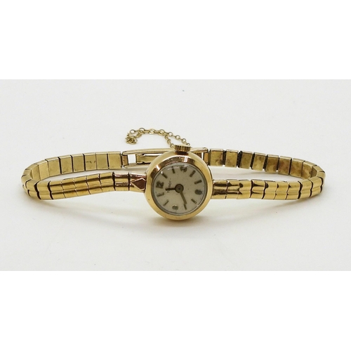 703 - A 9ct gold ladies Tissot watch with integral strap, diameter of the case 16.8mm,  weight 16gms