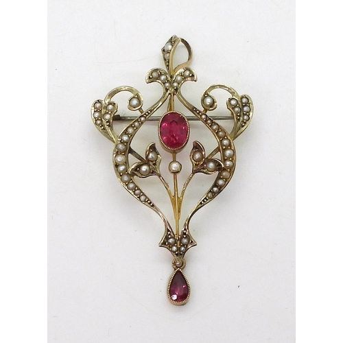 704 - A 9ct gold Edwardian pendant brooch, set with pearls and red gems, with a detachable bail. Length 5.... 