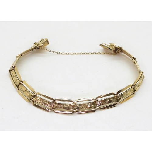 710 - A 9ct gold decorative panel bracelet, hallmarked Chester 1955, length 17.5cm, weight 12.1gms &n... 