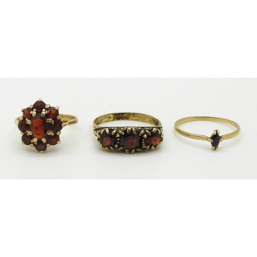 721 - A 9ct gold garnet cluster ring size J1/2, a 9ct sapphire ring size K1/2, weight together 3gms and a ... 