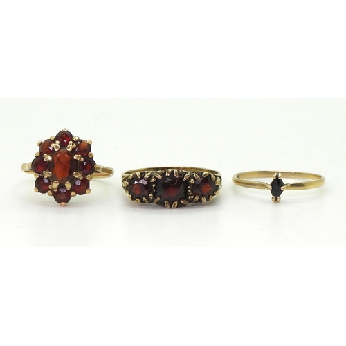 721 - A 9ct gold garnet cluster ring size J1/2, a 9ct sapphire ring size K1/2, weight together 3gms and a ... 