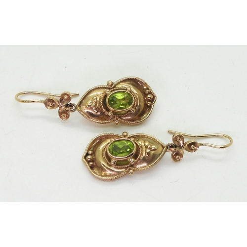 741 - A pair of yellow metal peridot earrings, length 4.2cm, weight 8gms