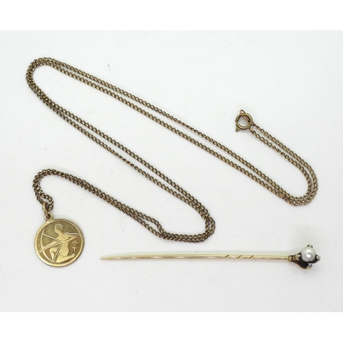 742 - A German 8ct gold Sagittarius pendant and 64cm chain, together with a yellow metal eagle's claw lape... 