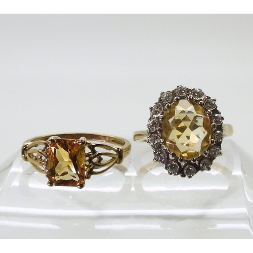 745 - A 9ct gold citrine ring, size O1/2, together with a further citrine ring with cubic zircona size K1/... 