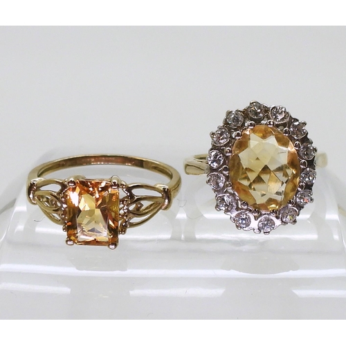 745 - A 9ct gold citrine ring, size O1/2, together with a further citrine ring with cubic zircona size K1/... 