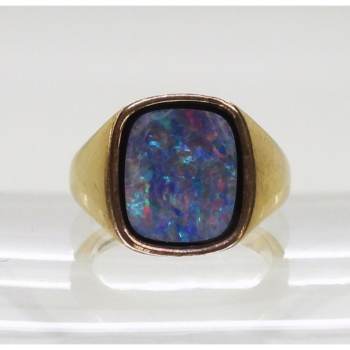 746 - A 9ct gold gents signet ring set with an opal doublet on onyx, finger size R, weight 9gms