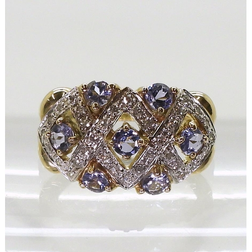 747 - A 9ct gold ring by QVC set with tanzanites and diamond accents, finger size N1/2, weight 4.2gms