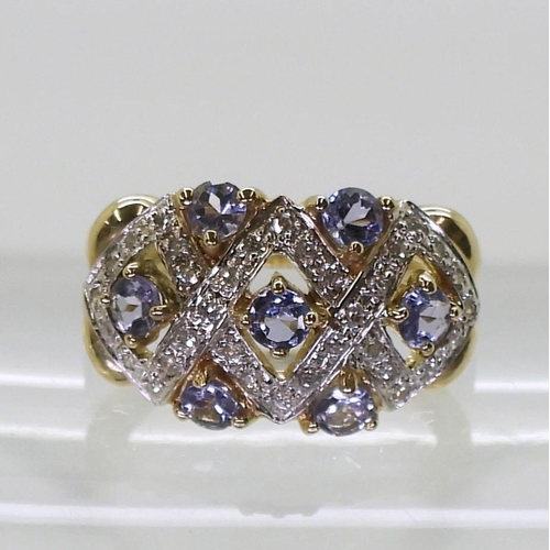 747 - A 9ct gold ring by QVC set with tanzanites and diamond accents, finger size N1/2, weight 4.2gms