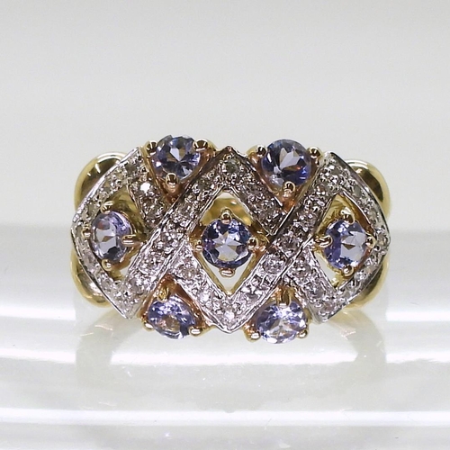 747 - A 9ct gold ring by QVC set with tanzanites and diamond accents, finger size N1/2, weight 4.2gms