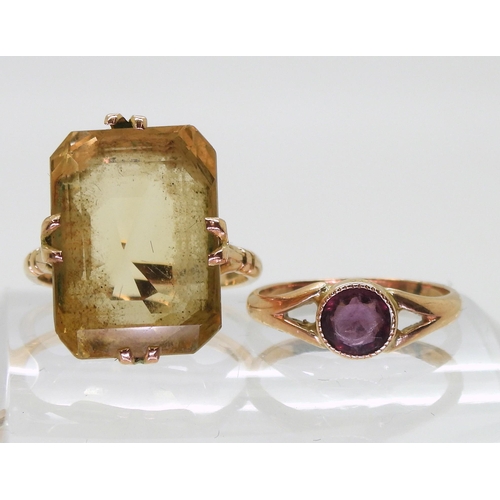 755 - A 9ct gold large citrine ring, citrine approx 18mm x 13mm, finger size P1/2, and a 9ct purple gem ri... 