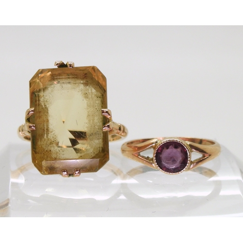 755 - A 9ct gold large citrine ring, citrine approx 18mm x 13mm, finger size P1/2, and a 9ct purple gem ri... 