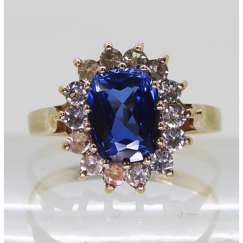 762 - A 9ct gold blue and  clear gem cluster ring, size O, weight 2.5gms