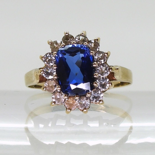 762 - A 9ct gold blue and  clear gem cluster ring, size O, weight 2.5gms