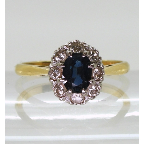 763 - An 18ct gold sapphire and diamond cluster ring, set with estimated approx 0.40cts of brilliant cut d... 