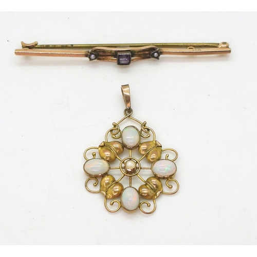 772 - An Arts & Crafts pendant, set with four opals and a pearl,  length with bail 3.5cm, a 9ct g... 