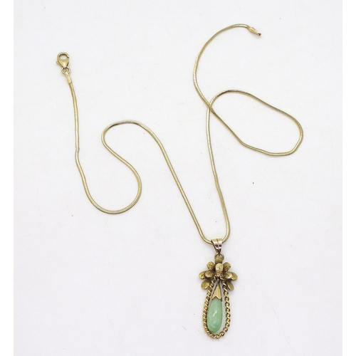 792 - A 14k gold Chinese green hardstone pendant weight 2.5gms, together with a 9ct gold snake chain weigh... 