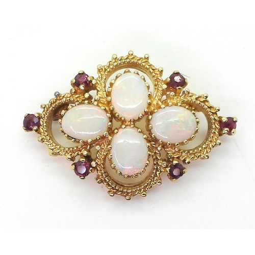 794 - A yellow metal opal and red gem set brooch, weight 10.1gms