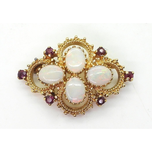 794 - A yellow metal opal and red gem set brooch, weight 10.1gms