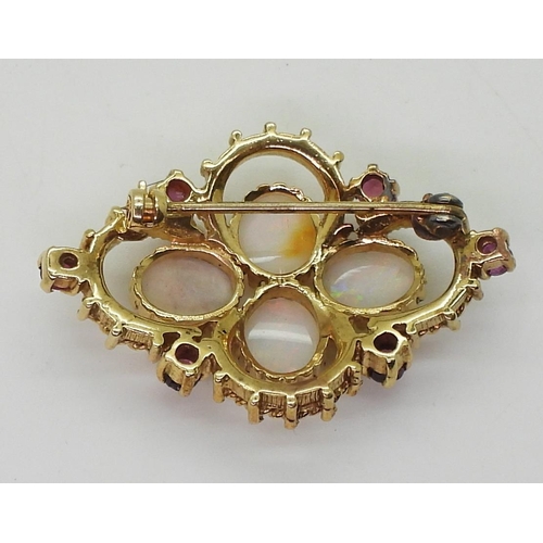 794 - A yellow metal opal and red gem set brooch, weight 10.1gms